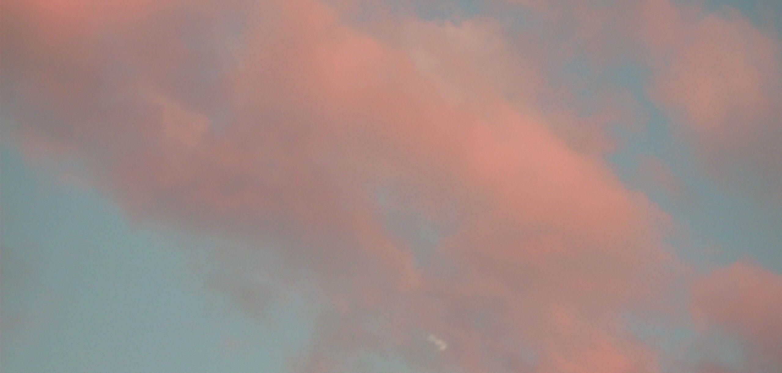 Pink clouds on a blue sky