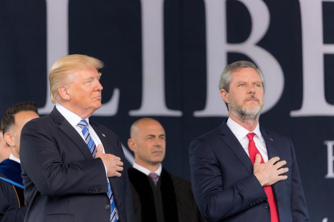 President Trump and Jerry Falwell Jr. with their hands on their chest.
