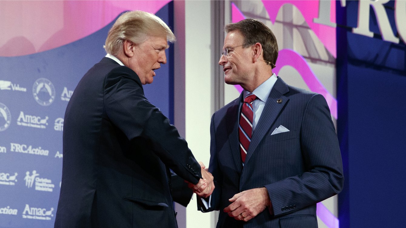  Donald Trump shakes hands with Family Research Council president Tony Perkins at the 2017 Value Voters Summit, Friday, Oct. 13, 2017, in Washington. 