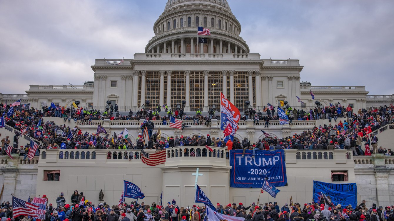 The Capitol building in D.C and Trump supporters all over it.