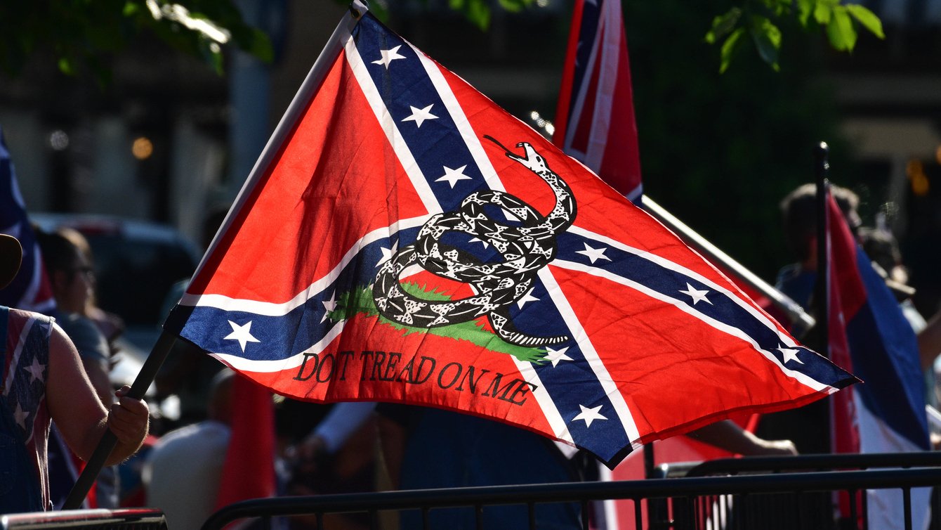A confederate flag with a "don't tread on me" symbol on it.