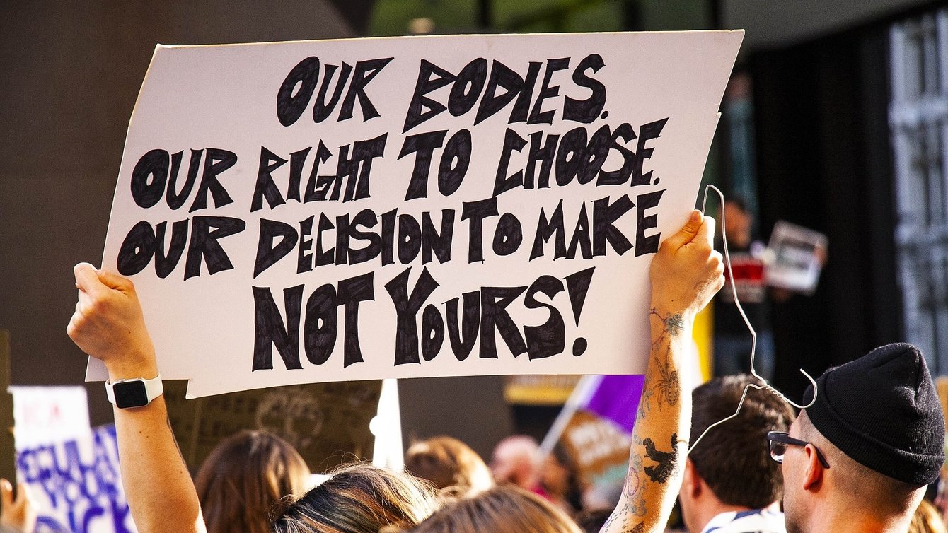 Protester at Rally for Reproductive Rights Chicago Illinois, sign says: Our Bodies, Our Right to Choose, Our Decision to make not yours!"