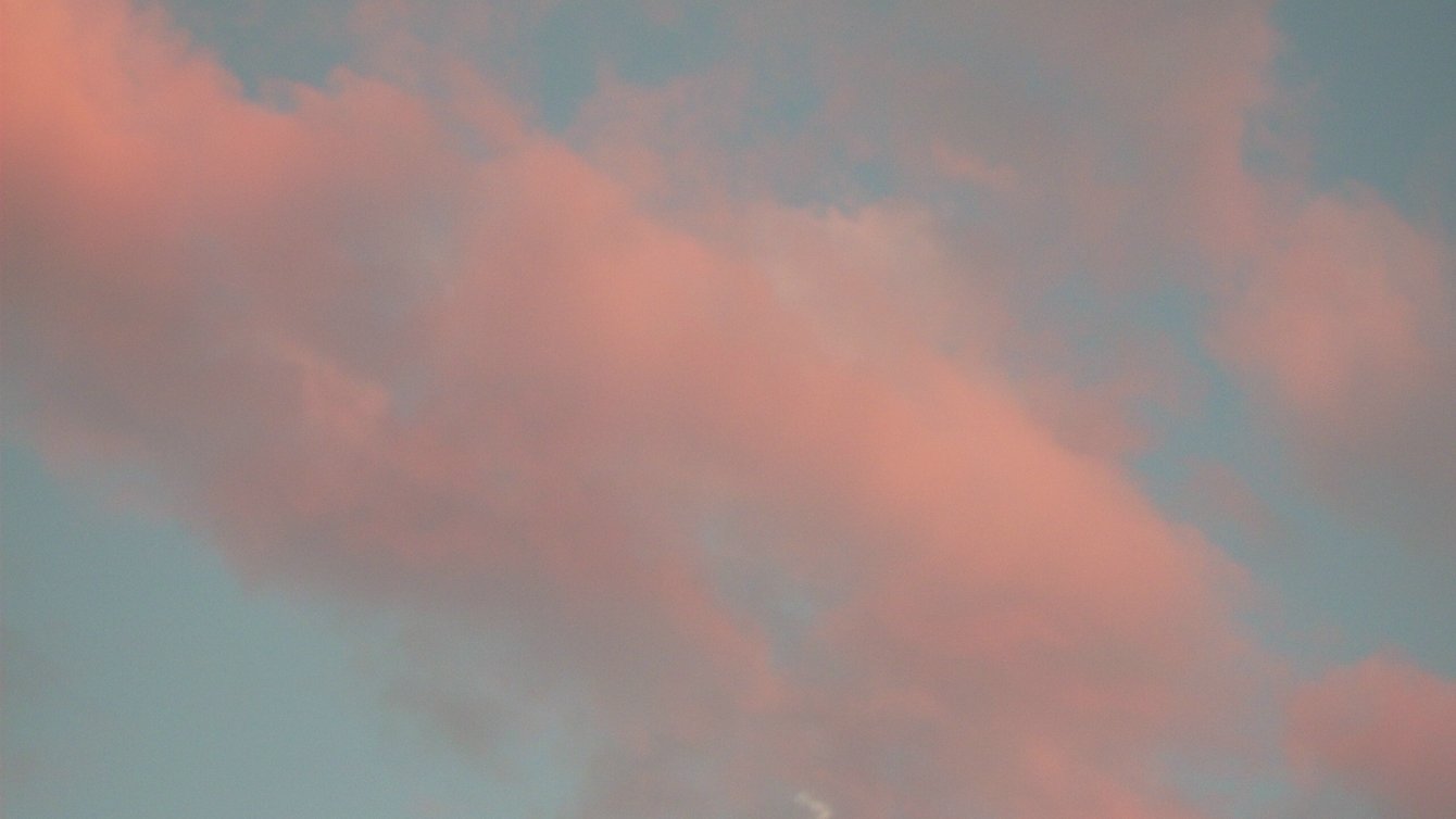 Pink clouds on a blue sky