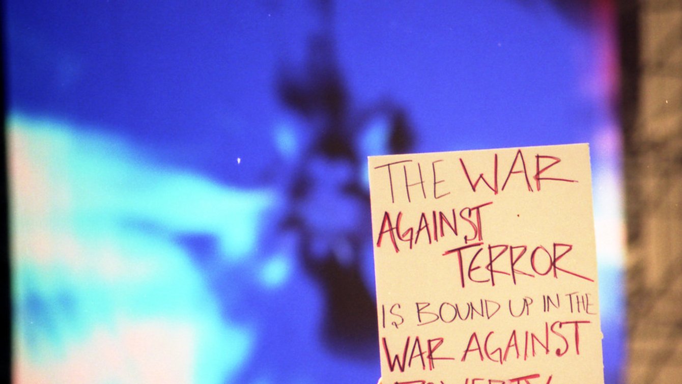 A sign that reads: The War Against Terror is bound up in the War Against Poverty