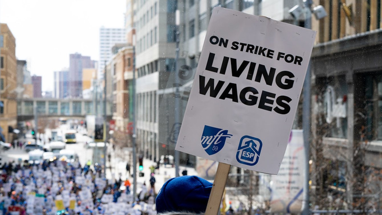 A sign that says "On strike for living wages"