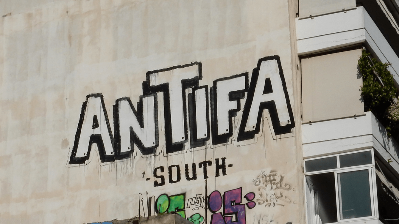 Building graffiti that reads "Antifa South"