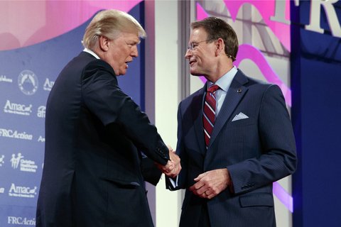  Donald Trump shakes hands with Family Research Council president Tony Perkins at the 2017 Value Voters Summit, Friday, Oct. 13, 2017, in Washington. 