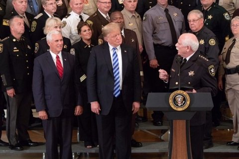 U.S President Donald Trump and Vice President Mike Pence look on as Sheriff Thomas Hodgson of Bristol County Massachusetts delivers remarks in the East Room of the White House September 5, 2018 in Washington, DC.
