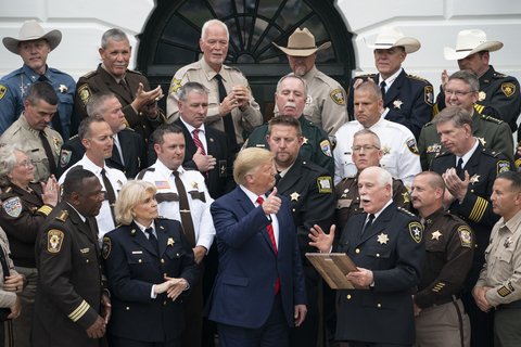 President Donald J. Trump gives a thumbs-up as he is presented with a plaque of recognition by “The Nation’s Sheriffs,” Thursday, Sept. 26, 2019, at the South Portico of the White House. (Official White House Photo by Joyce N. Boghosian)