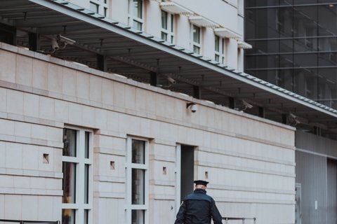 Police officer walking in empty street