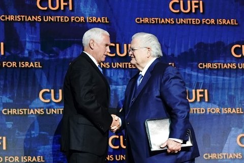 Vice President Mike Pence shakes John Hagee's hand and delivers remarks at the Christians United for Israel Washington Summit in Washington, D.C. Monday, July 8, 2019. (Official White House Photo/Flickr)