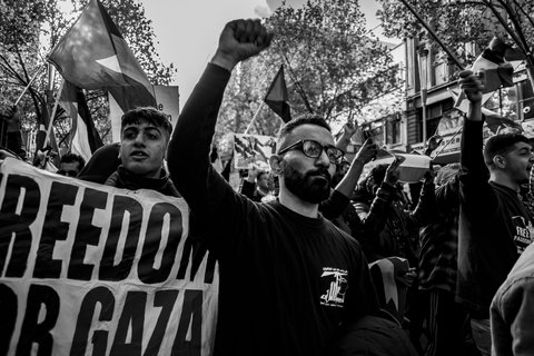 Black and white photo of protesters with raised fists
