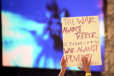 A sign that reads: The War Against Terror is bound up in the War Against Poverty