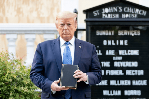 Donald Trump holding a bible outside a church