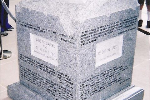 A stone slab with inscriptions on it.