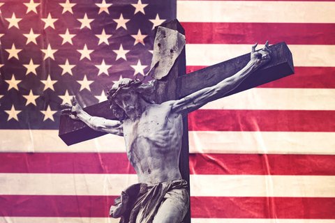 Jesus on the cross with the American flag in the background