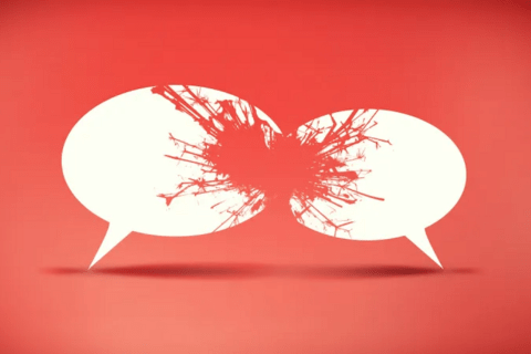 Two clashing speech bubbles with sparks in red over them.