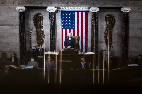Kevin McCarthy standing in front of an American flag. 