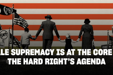 A family holding hands withs Proud boys and anti-abortion banners around them.