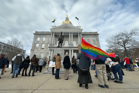 LGBTQ advocates in front of the New Hampshire state house.