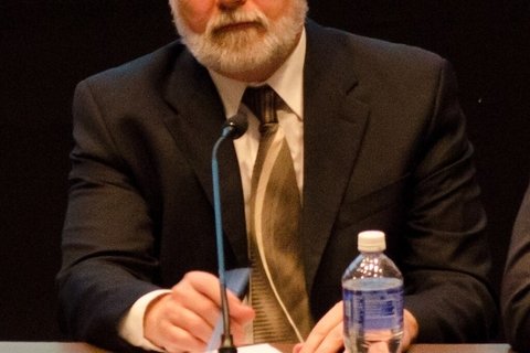 Scott Lively speaking into a mic