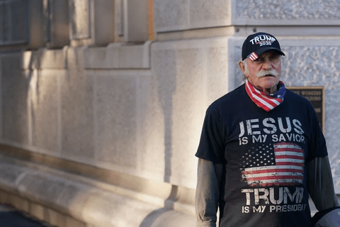 A man wearing a t-shirt that says 