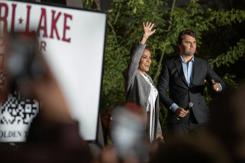 Charlie Kirk and Kari Lake in the background of an image.