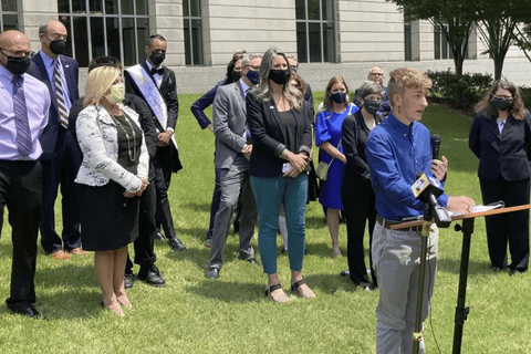 people standing on grass