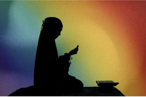 A silhouette of a person in a hijab praying with a rainbow gradient as a background