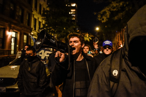 Nick Fuentes talking into a megaphone