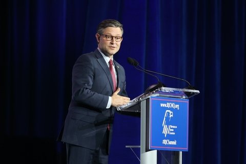 Mike Johnson at a podium