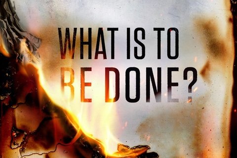 A paper burning with the letters "What is to be done?"