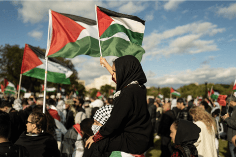 A protest with people carrying Palestinian flags