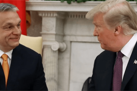 Two men in suits looking at each other.