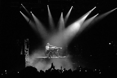 D’Angelo at piano lit by spotlights (Brixton)