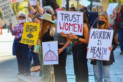 Four protest with pro-abortion posters