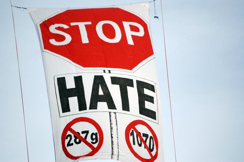A banner that reads "Stop Hate" and crosses out 287g and 1070