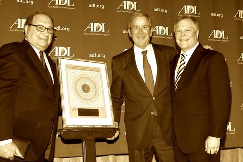 ADL director Abe Foxman hands an award to George W. Bush