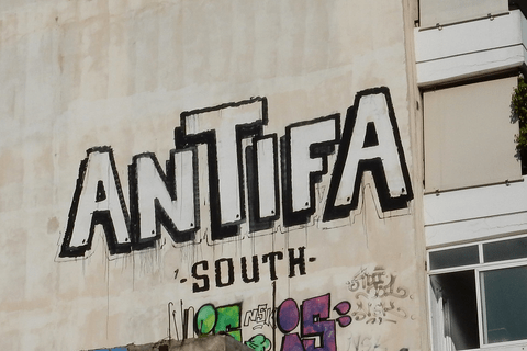 Building graffiti that reads "Antifa South"