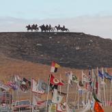 Riders on horseback overlook Oceti Sakowin Camp occupied by Standing Rock protesters.