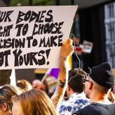 Protester at Rally for Reproductive Rights Chicago Illinois, sign says: Our Bodies, Our Right to Choose, Our Decision to make not yours!"