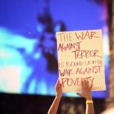 A sign that reads: The War Against Terror is bound up in the War Against Poverty