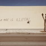 No One is Illegal painted on a wall