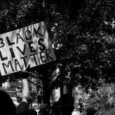 A protester holding a sign that says Black Lives Matter