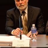 Scott Lively speaking into a mic