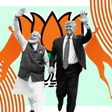 a cut out of Modi and Trump with orange flags and the BJP logo behind.