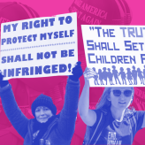 Two protestors with signs