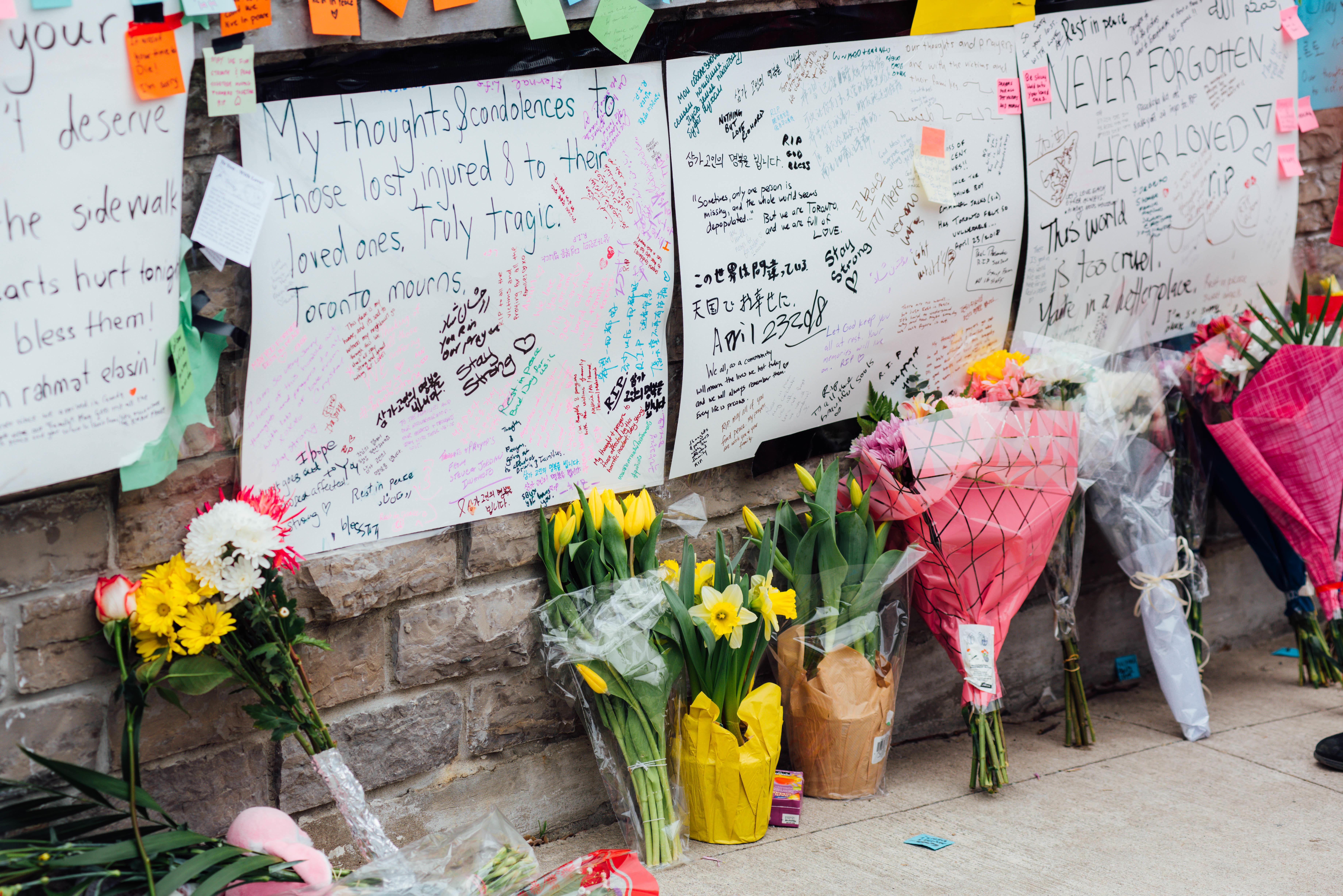 Flowers and messages are placed at a memorial for victims of the mass killing on April 24, 2018 in Toronto, Canada.