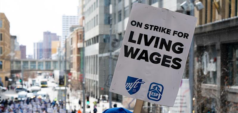 A sign that says "On strike for living wages"