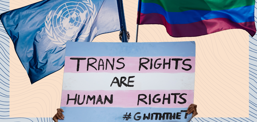 A UN flag, an LGBT flag and a sign that says "Trans rights are human rights"